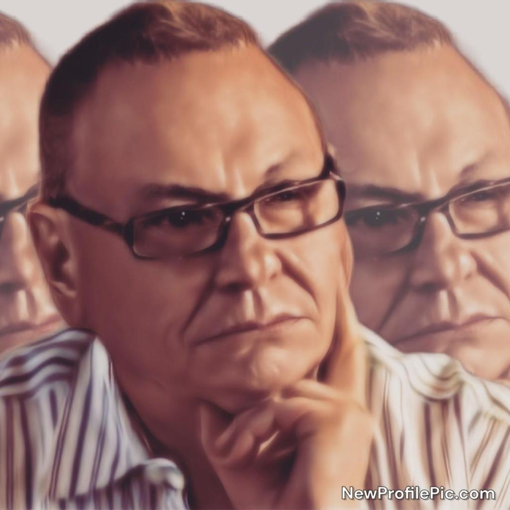 A portrait of a thoughtful person with glasses, resting their chin on their hand, with subtle blurred backgrounds.